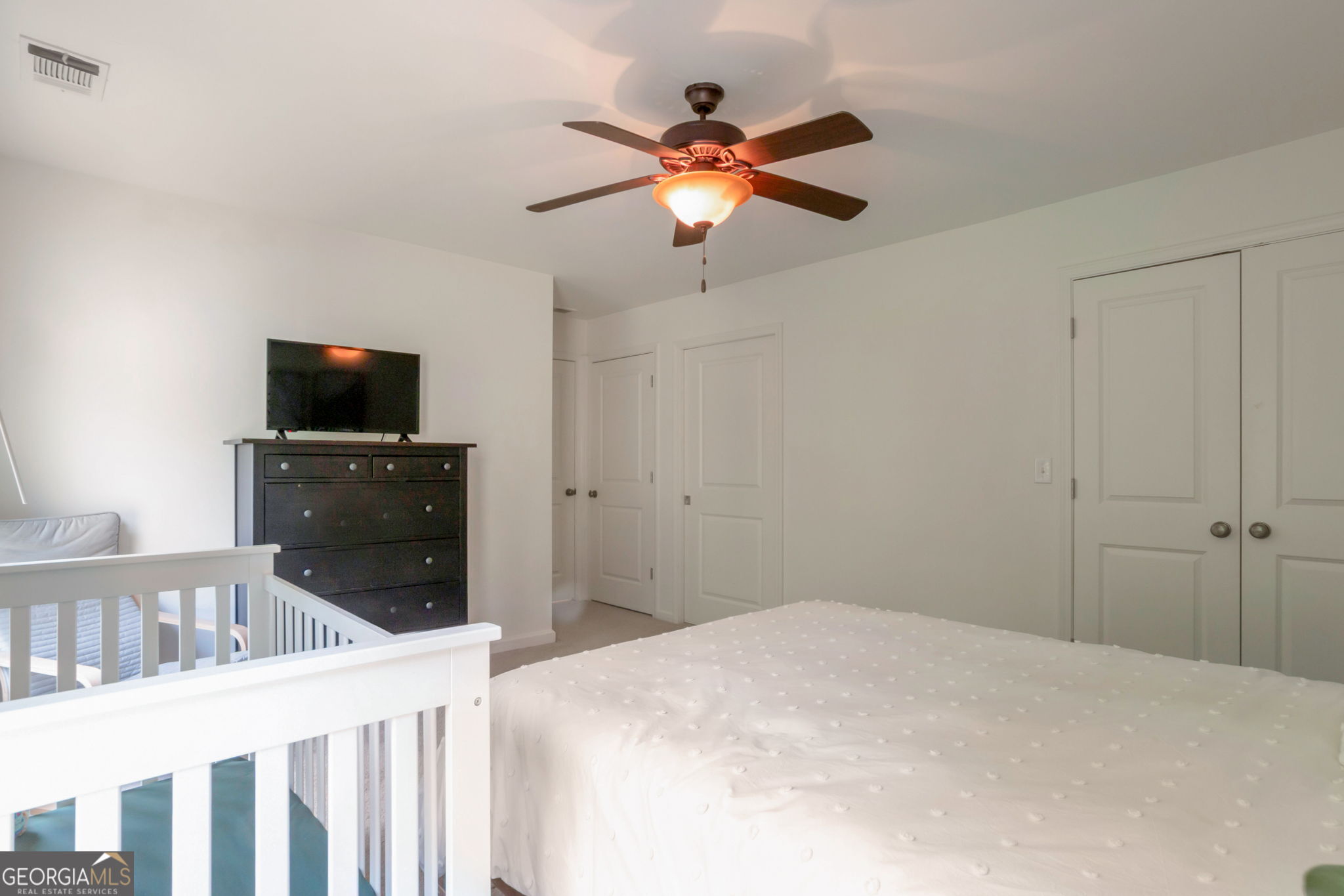 2524 Kickerillo Way Southeast Atlanta, GA 30316 - Photo 17 of 50 a bedroom with a bed and a flat screen tv