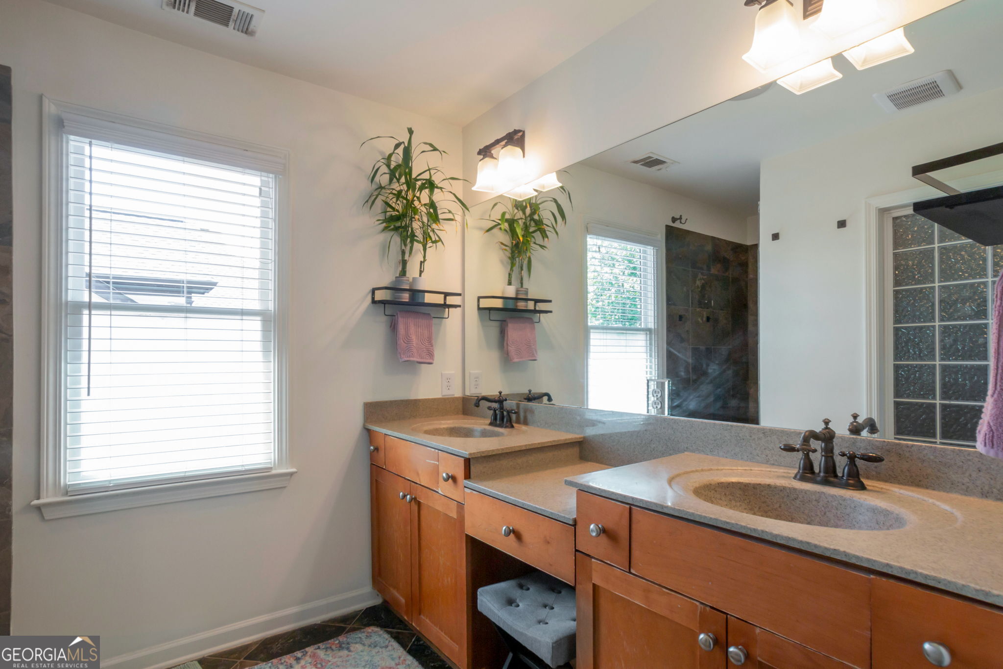 2524 Kickerillo Way Southeast Atlanta, GA 30316 - Photo 27 of 50 a bathroom with a double vanity sink and a mirror