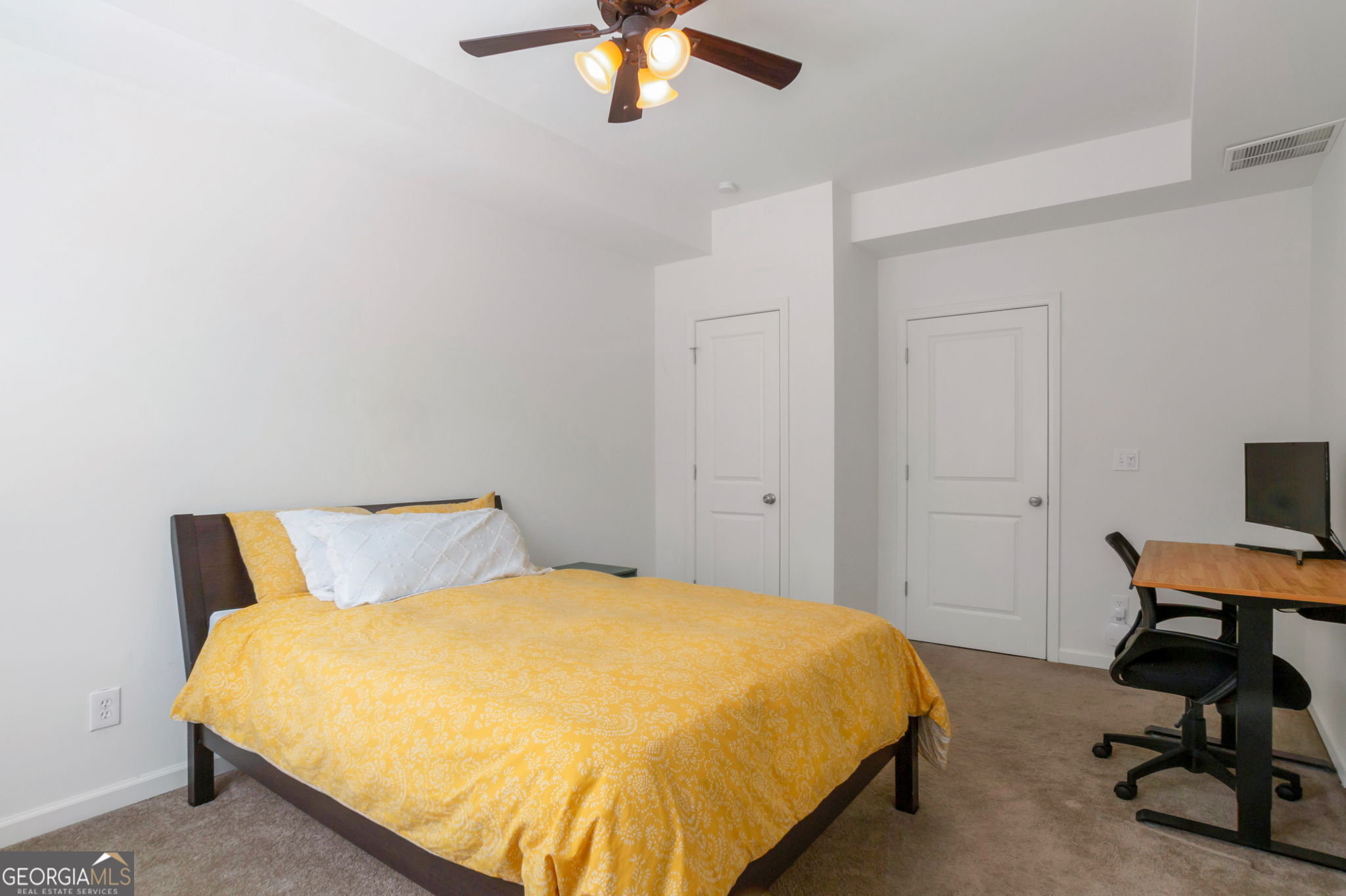 2524 Kickerillo Way Southeast Atlanta, GA 30316 - Photo 46 of 50 a bedroom with a bed and a chandelier