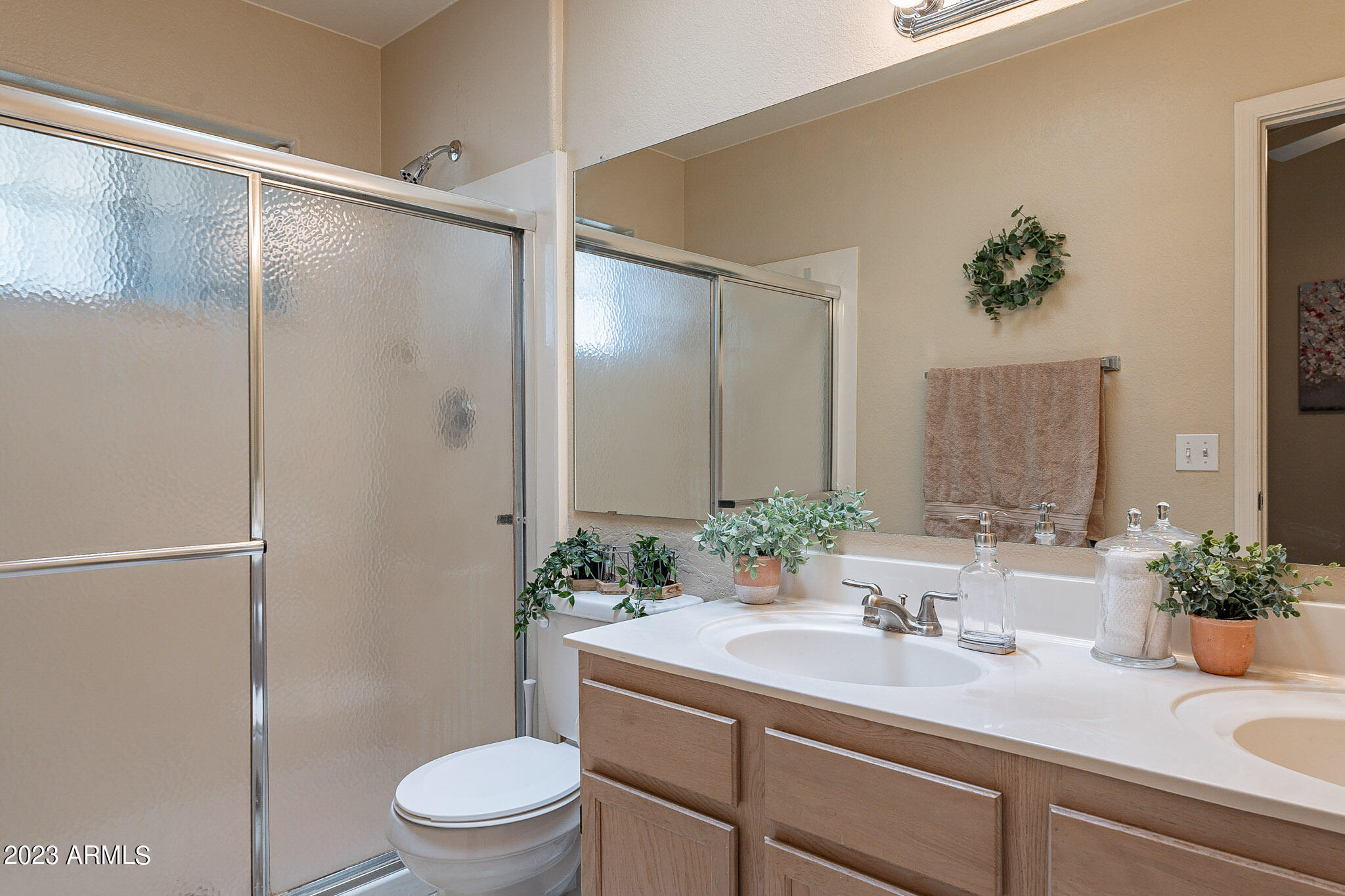 1222 West Baseline Road, Unit 237 Tempe, AZ 85283 - Photo 18 of 41 a bathroom with a shower sink vanity mirror and toilet