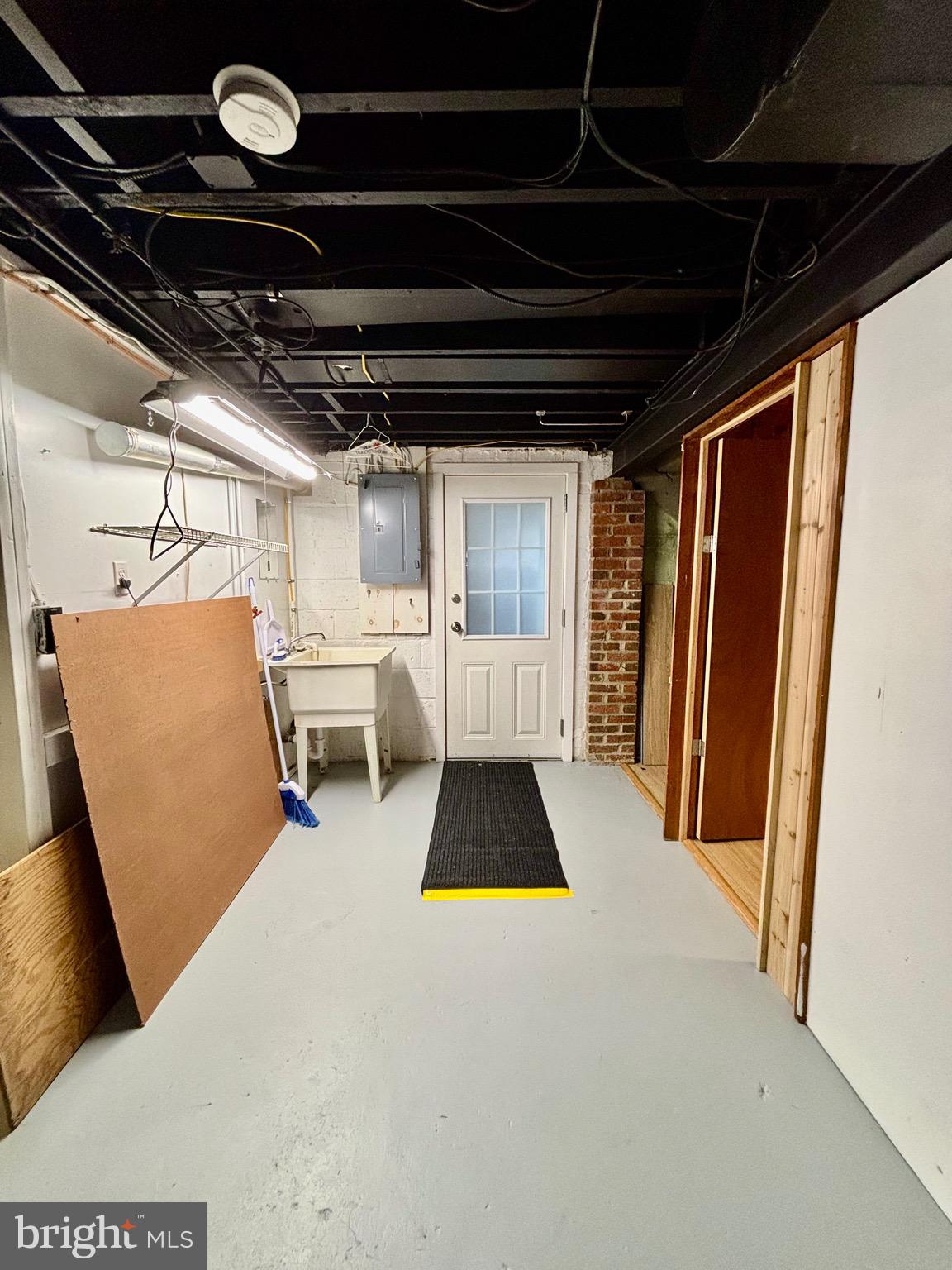 1507 Moffet Road Silver Spring, MD 20903 - Photo 54 of 55 laundry room in lower level with door to backyard