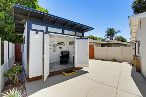 a view of backyard with cabin