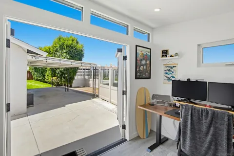 a workspace with furniture and window