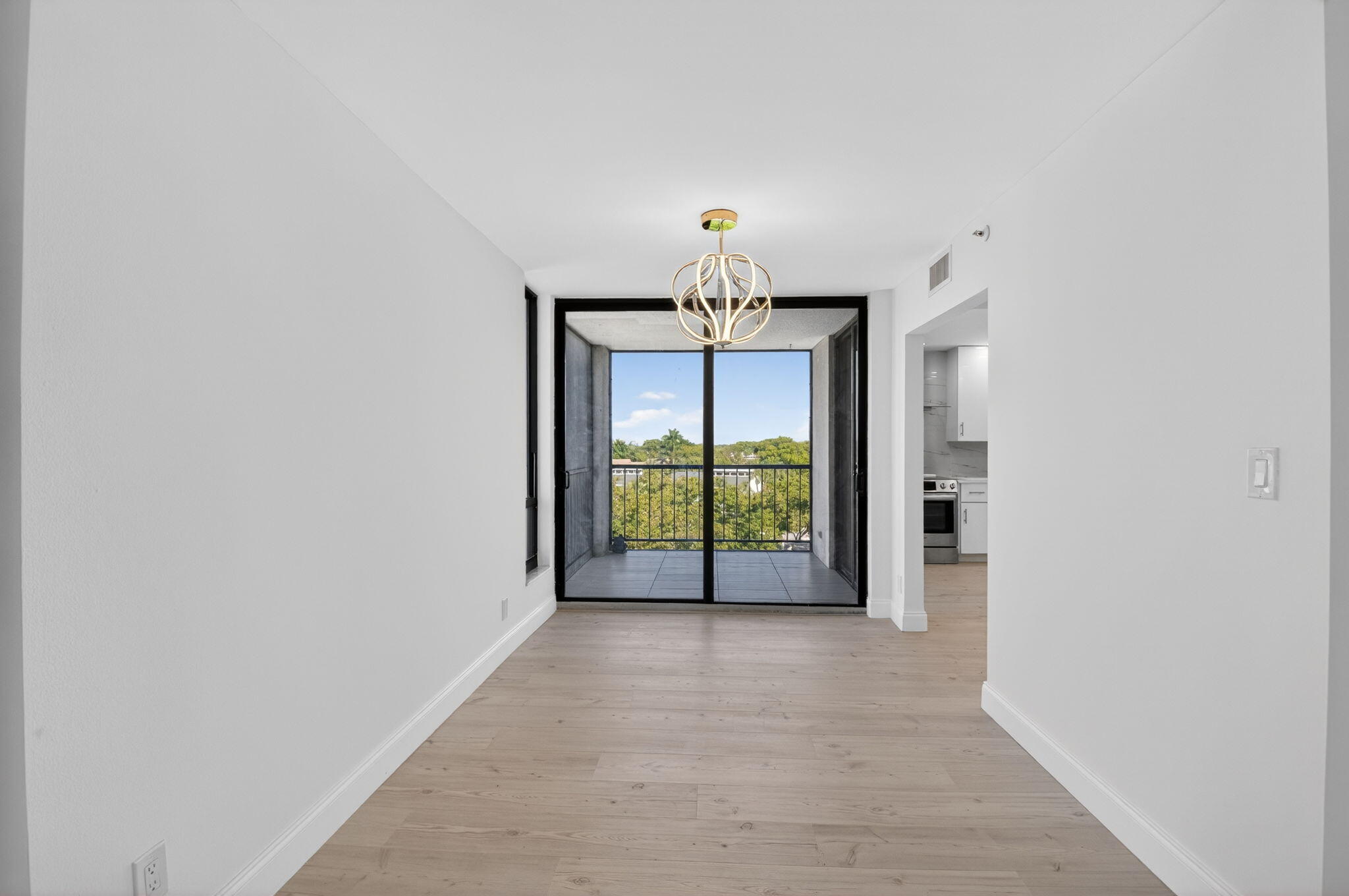 7738 Lakeside Boulevard, Unit 352 Boca Raton, FL 33434 - Photo 5 of 60 wooden floor in an empty room with a window