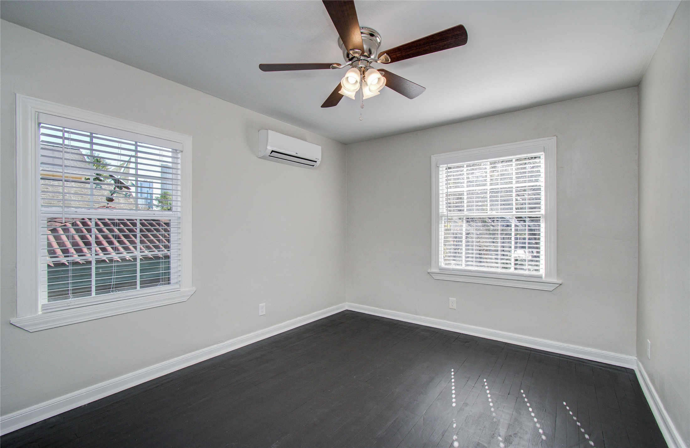 710 Hemphill Street, Unit 2 Houston, TX 77007 - Photo 15 of 21 a view of an empty room with a window and wooden floor