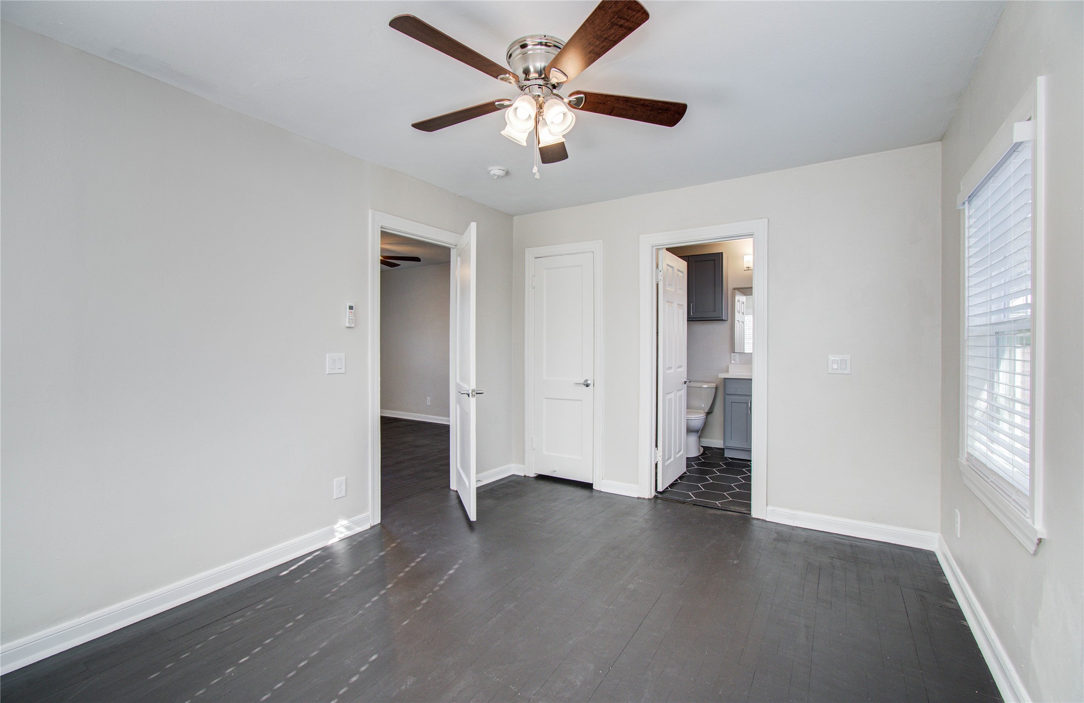 710 Hemphill Street, Unit 2 Houston, TX 77007 - Photo 16 of 21 an empty room with wooden floor and a ceiling fan