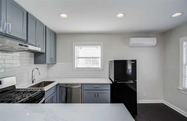 a bathroom with a bathtub and a sink