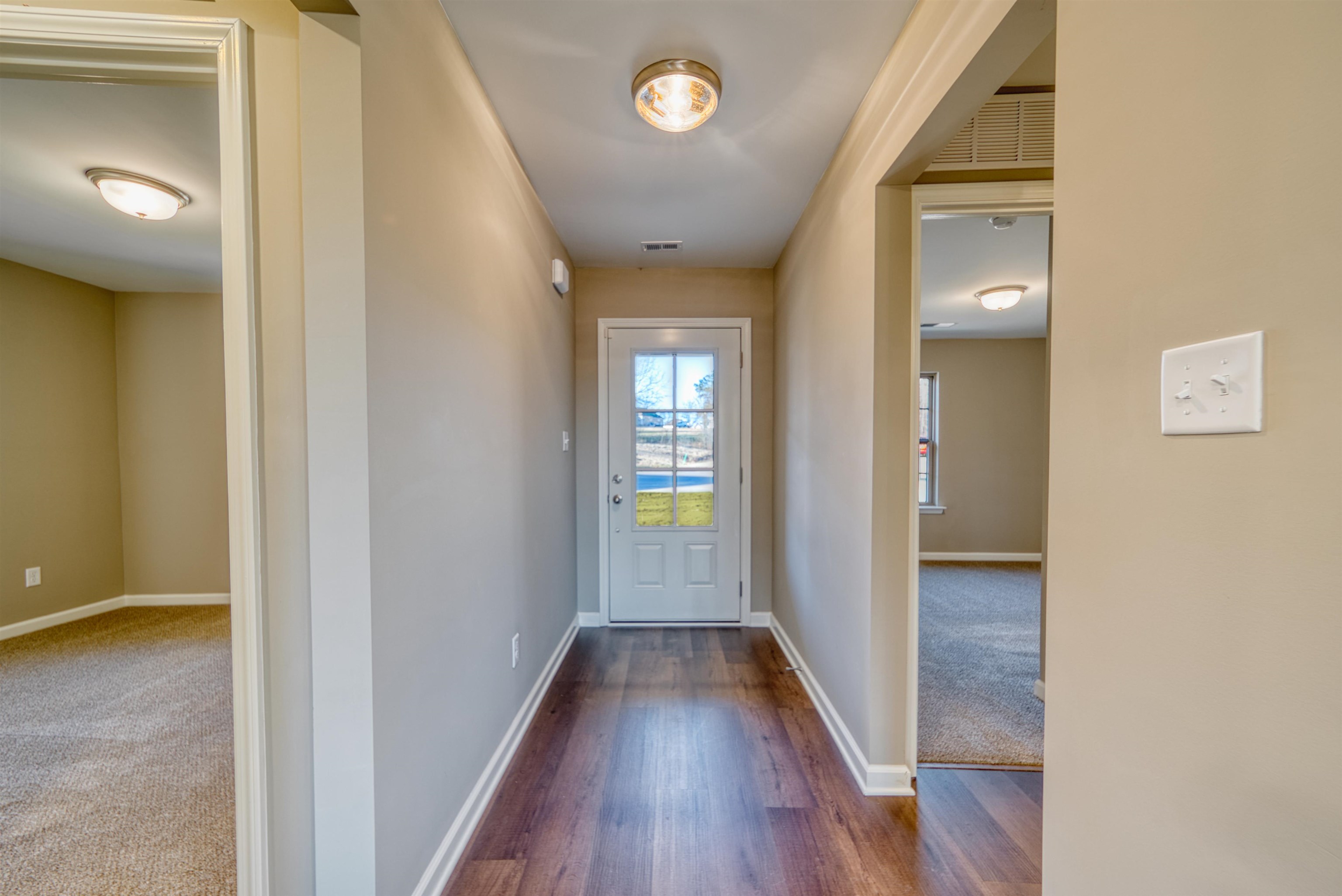 107 Stone Brook Cove Ripley, TN 38063 - Photo 12 of 31 a view of a hallway with wooden floor