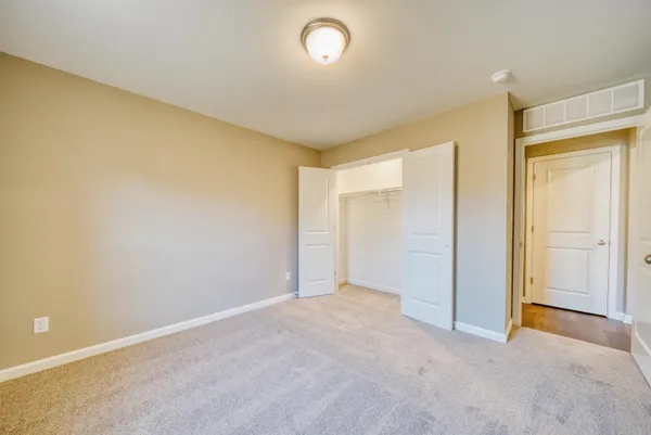 an empty room with a empty space and a window