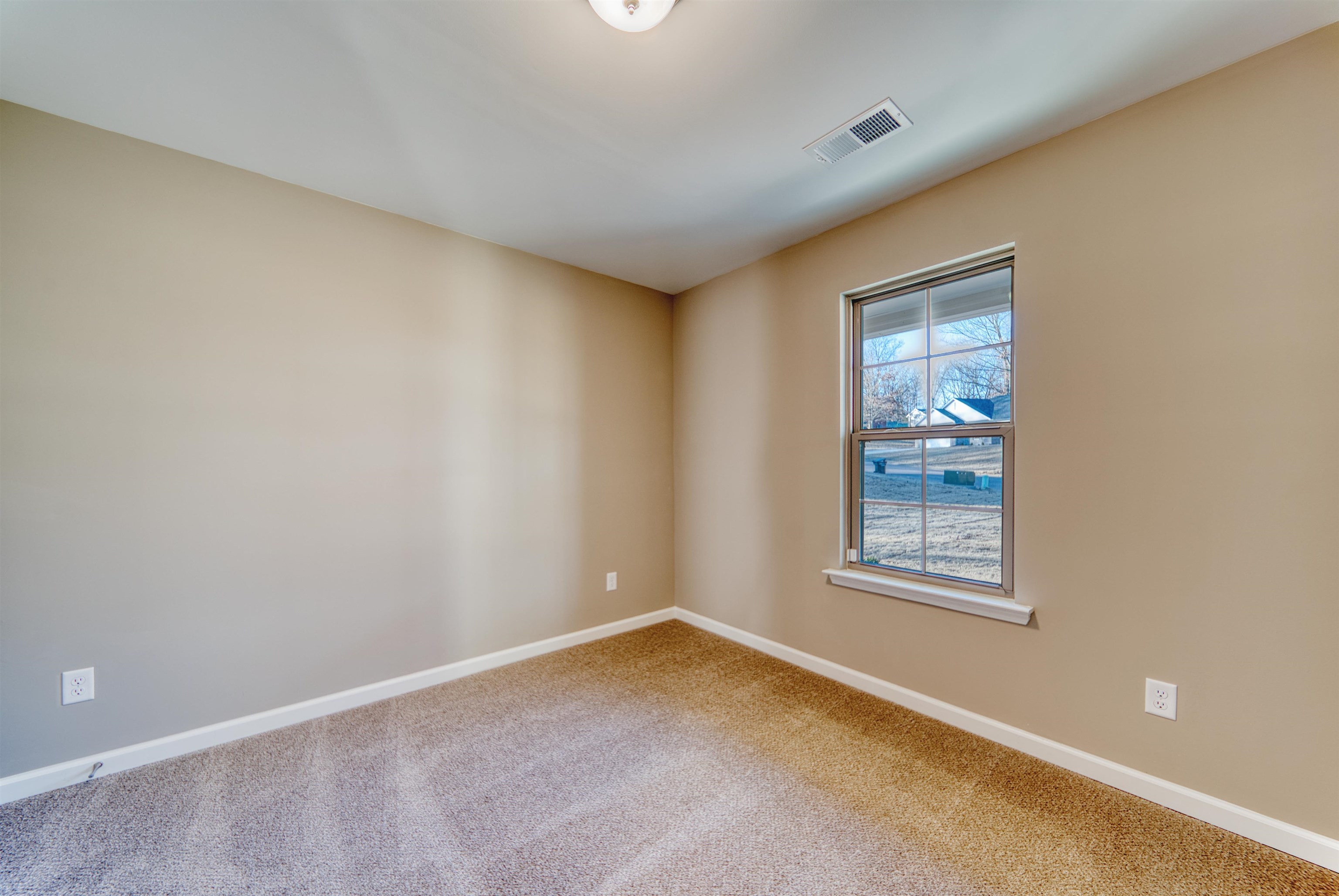 107 Stone Brook Cove Ripley, TN 38063 - Photo 16 of 31 an empty room with windows