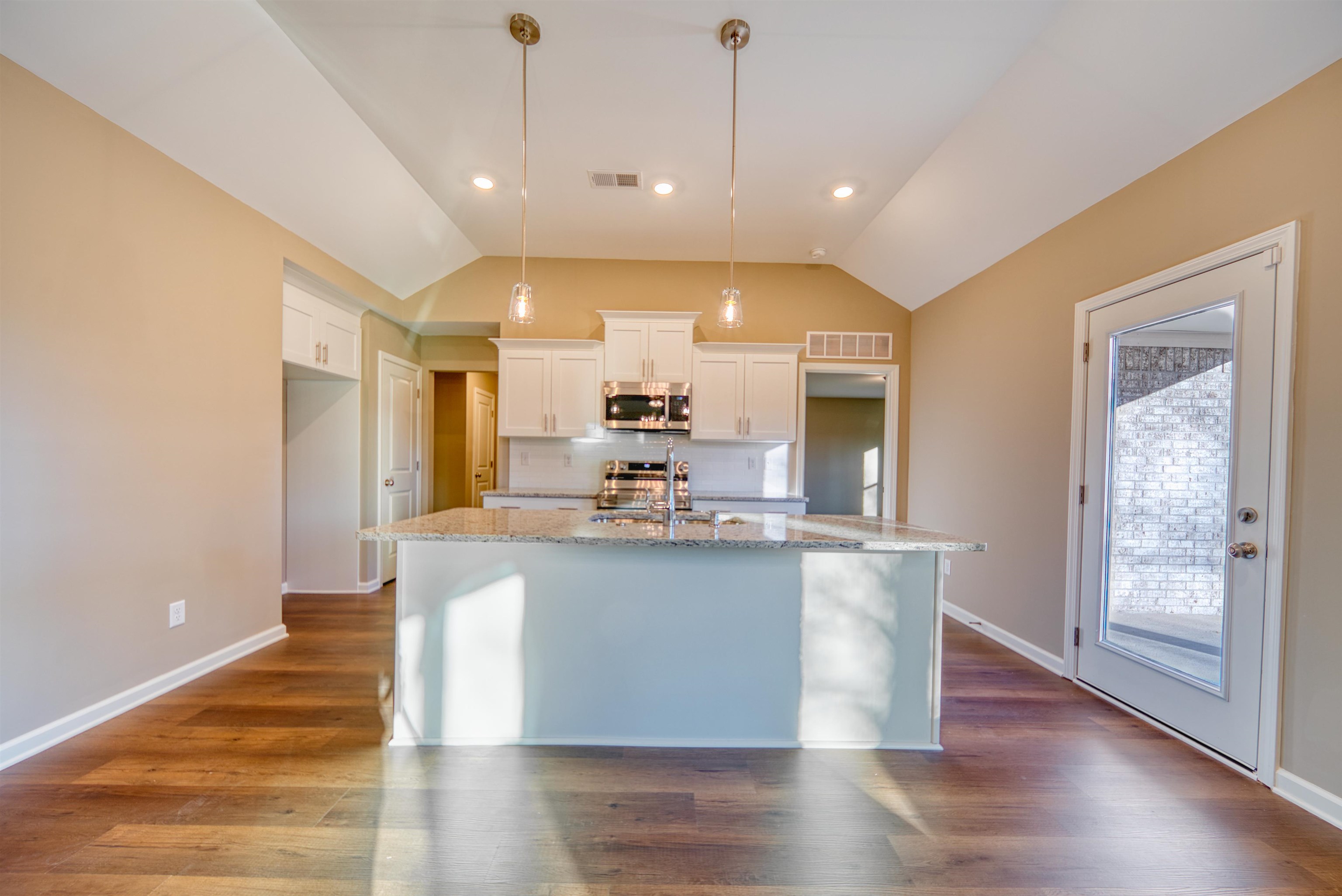 107 Stone Brook Cove Ripley, TN 38063 - Photo 20 of 31 a large kitchen with granite countertop a large counter top and stainless steel appliances