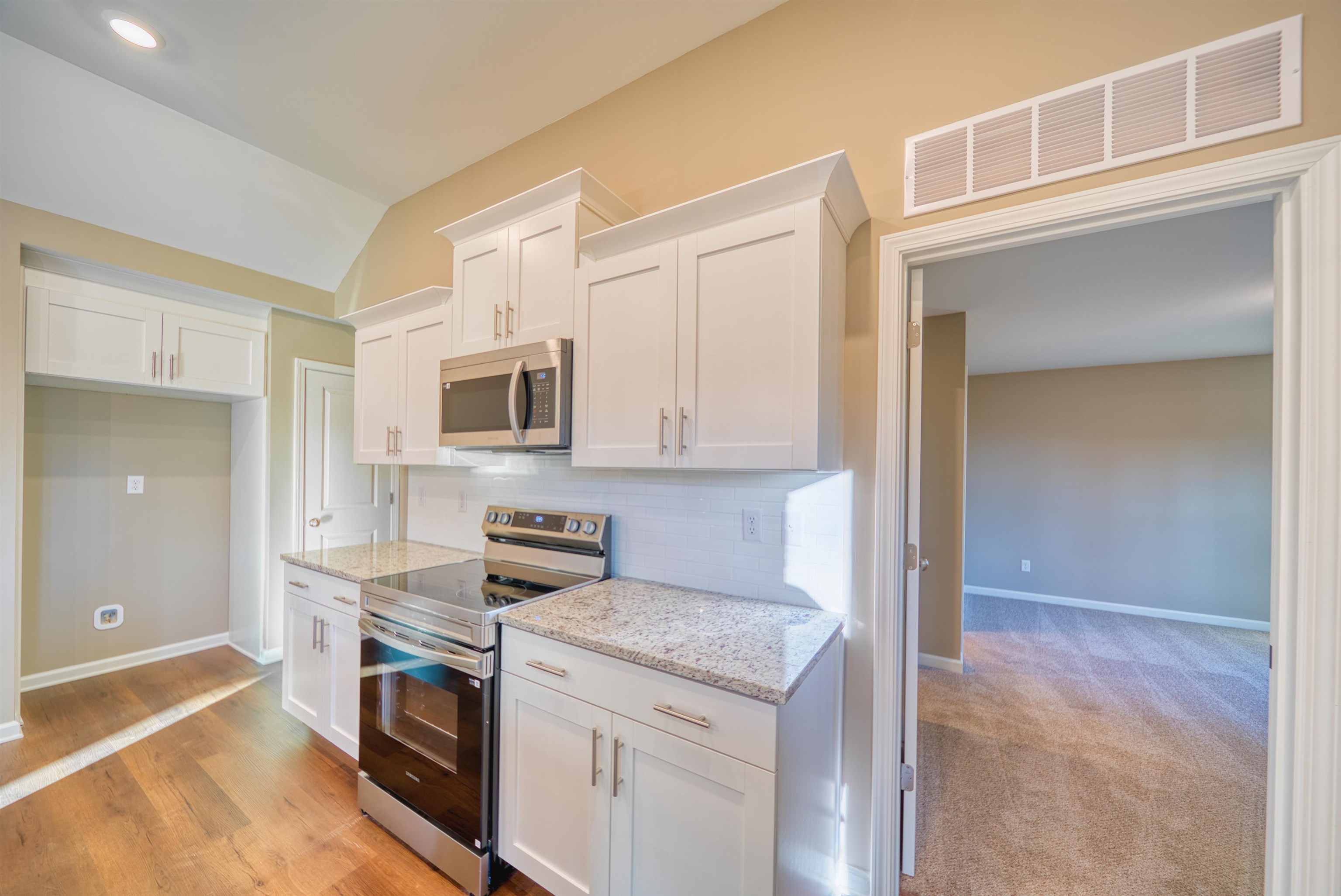 107 Stone Brook Cove Ripley, TN 38063 - Photo 22 of 31 a kitchen with stainless steel appliances granite countertop a stove and a refrigerator