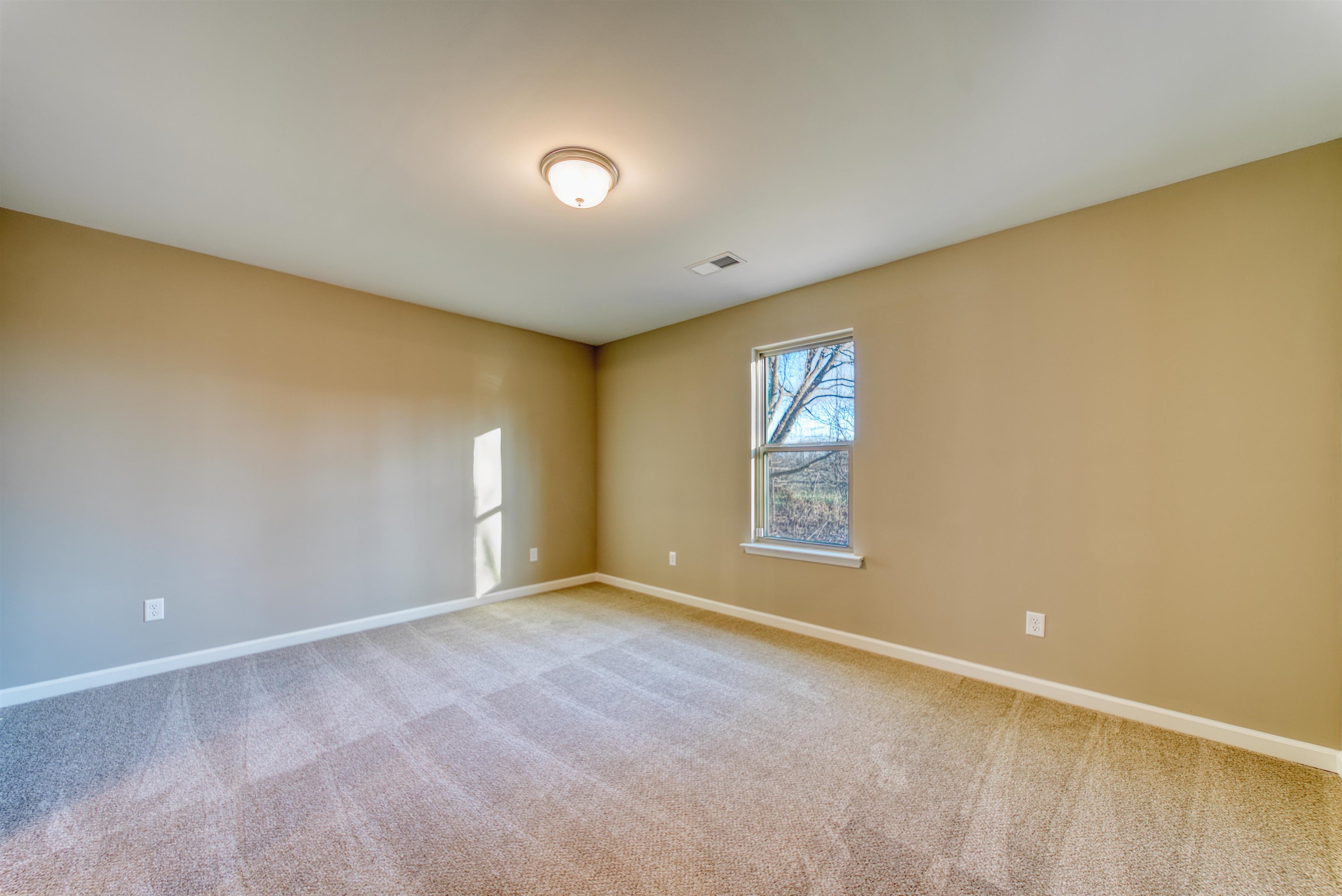 107 Stone Brook Cove Ripley, TN 38063 - Photo 24 of 31 a view of an empty room with a window