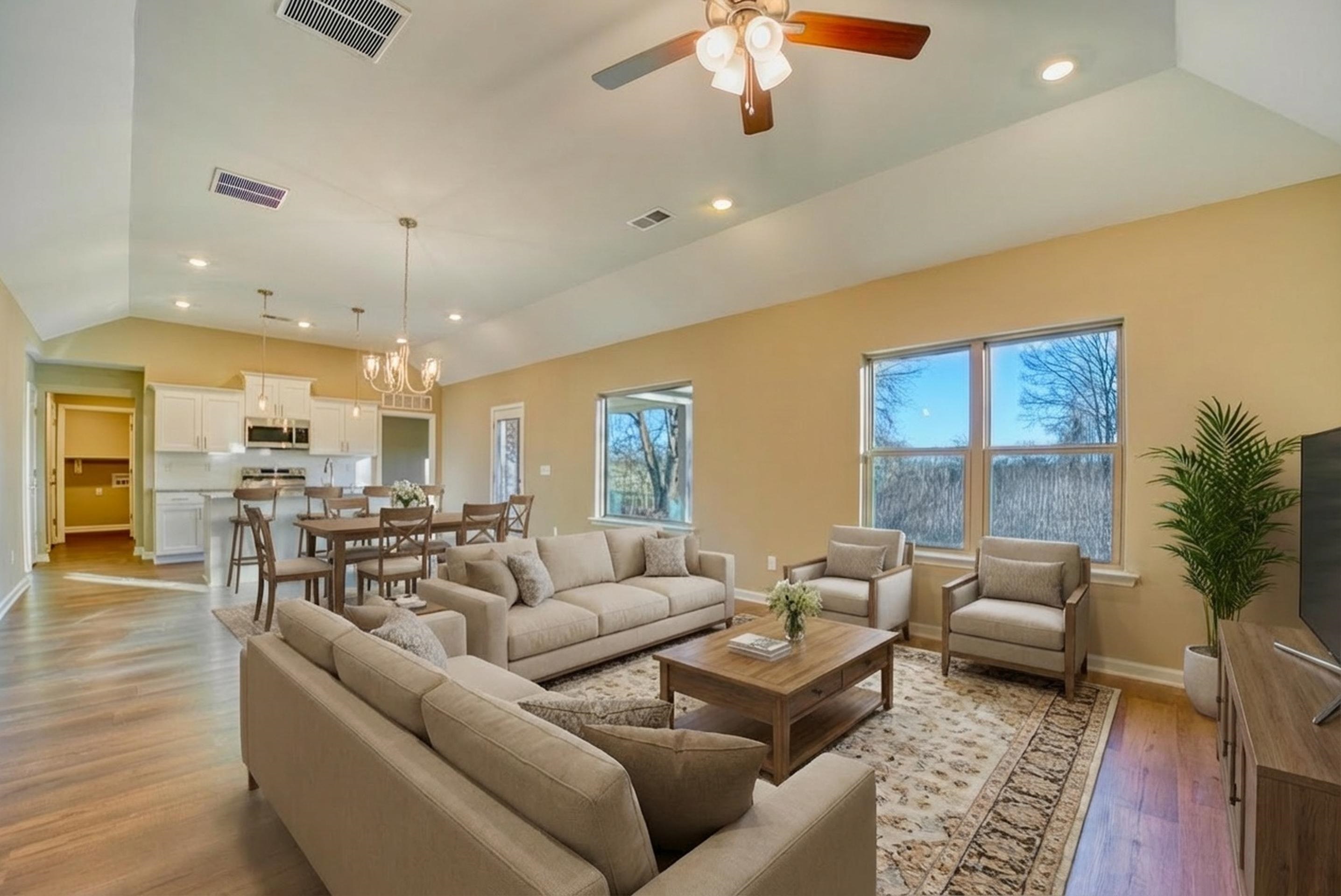 107 Stone Brook Cove Ripley, TN 38063 - Photo 3 of 31 a living room with furniture and a chandelier