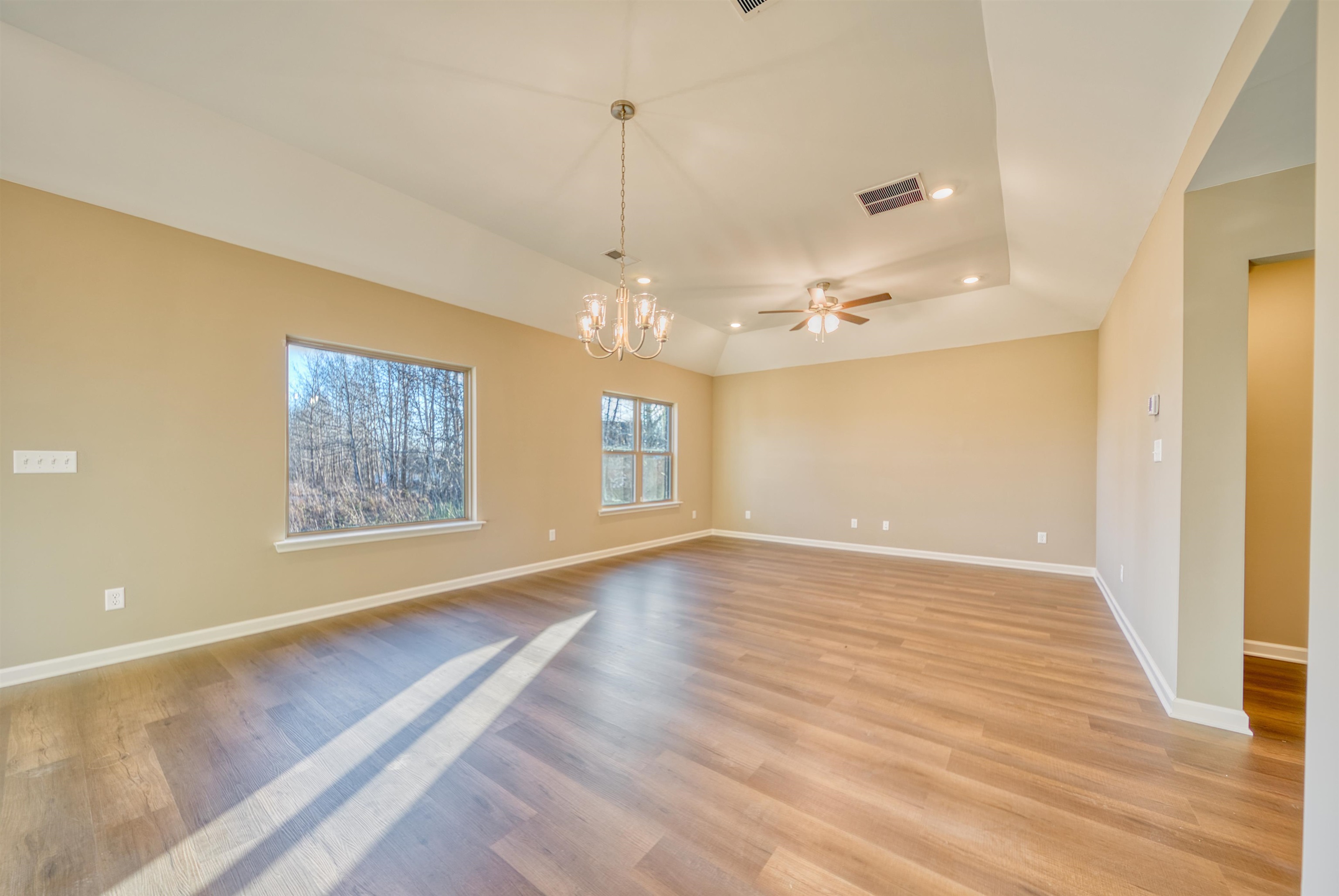 107 Stone Brook Cove Ripley, TN 38063 - Photo 30 of 31 a view of an empty room with window and wooden floor
