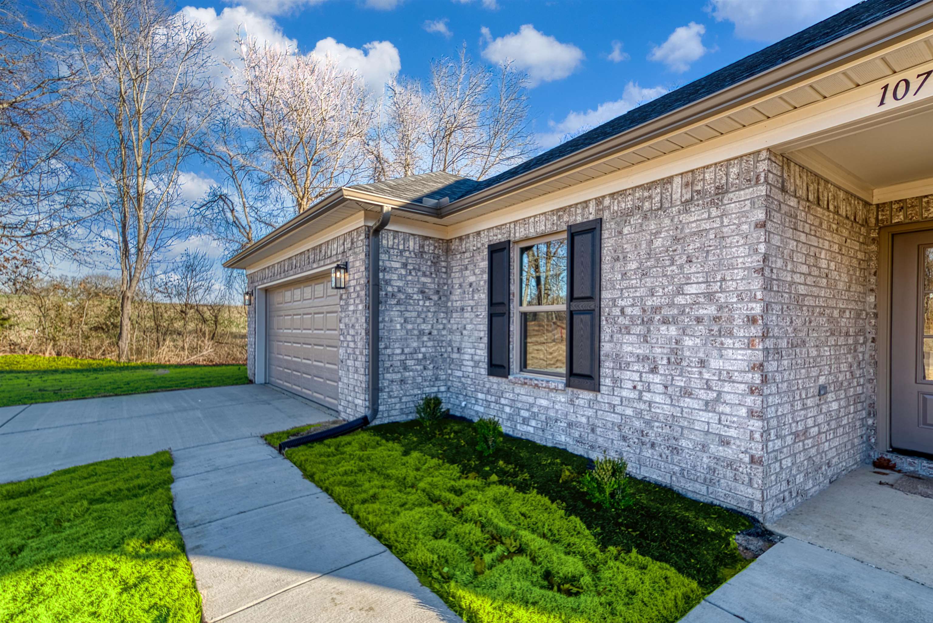 107 Stone Brook Cove Ripley, TN 38063 - Photo 7 of 31 a front view of a house with garden