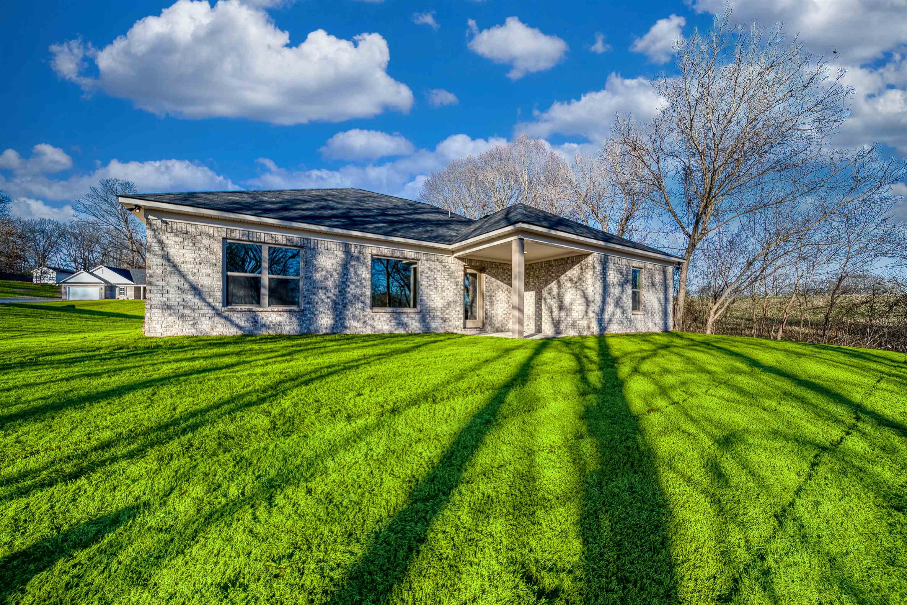 107 Stone Brook Cove Ripley, TN 38063 - Photo 10 of 31 a view of a house with a yard porch and sitting area