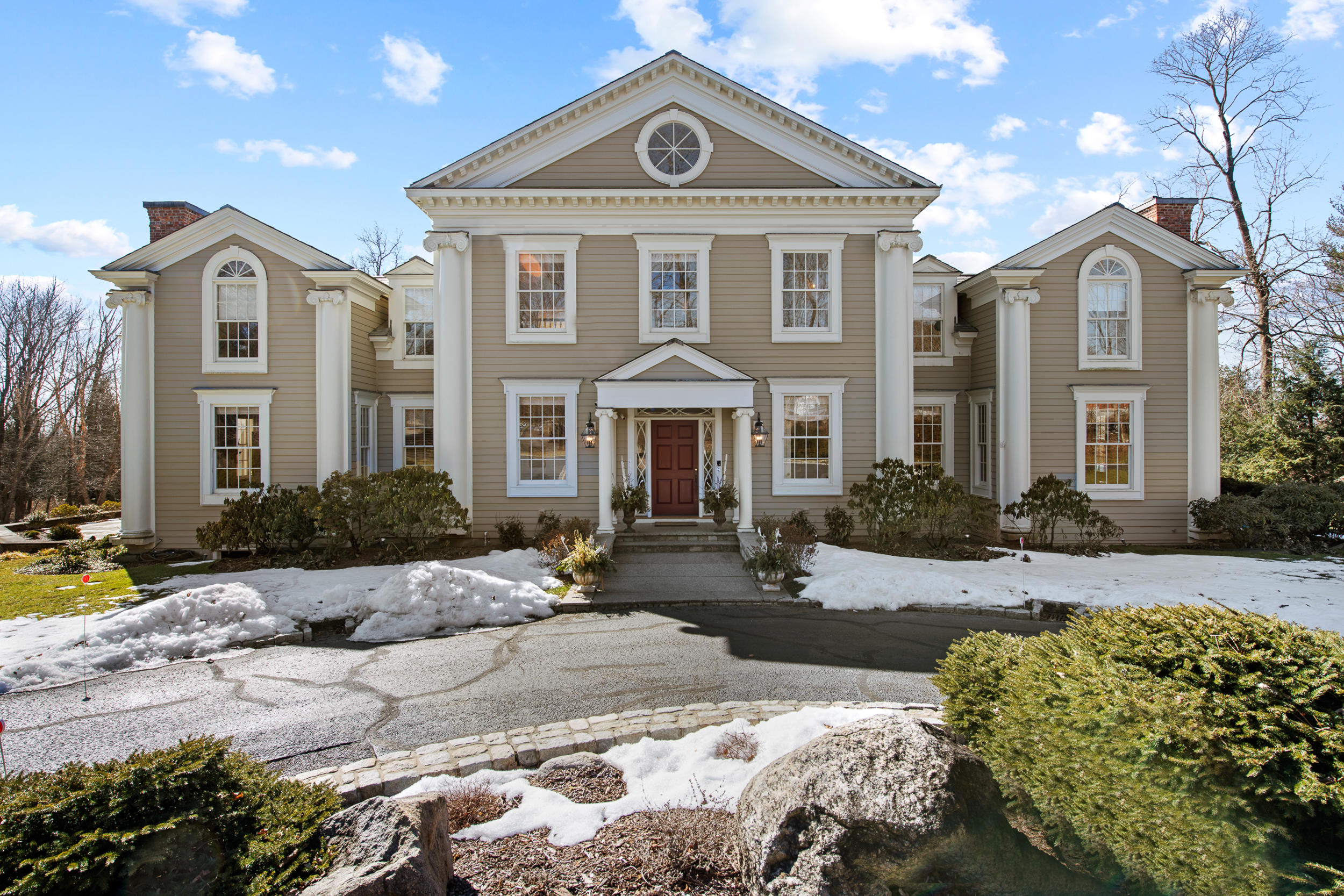 235 Brushy Ridge Road New Canaan, CT 06840 - Photo 1 of 28 a front view of a house with a yard