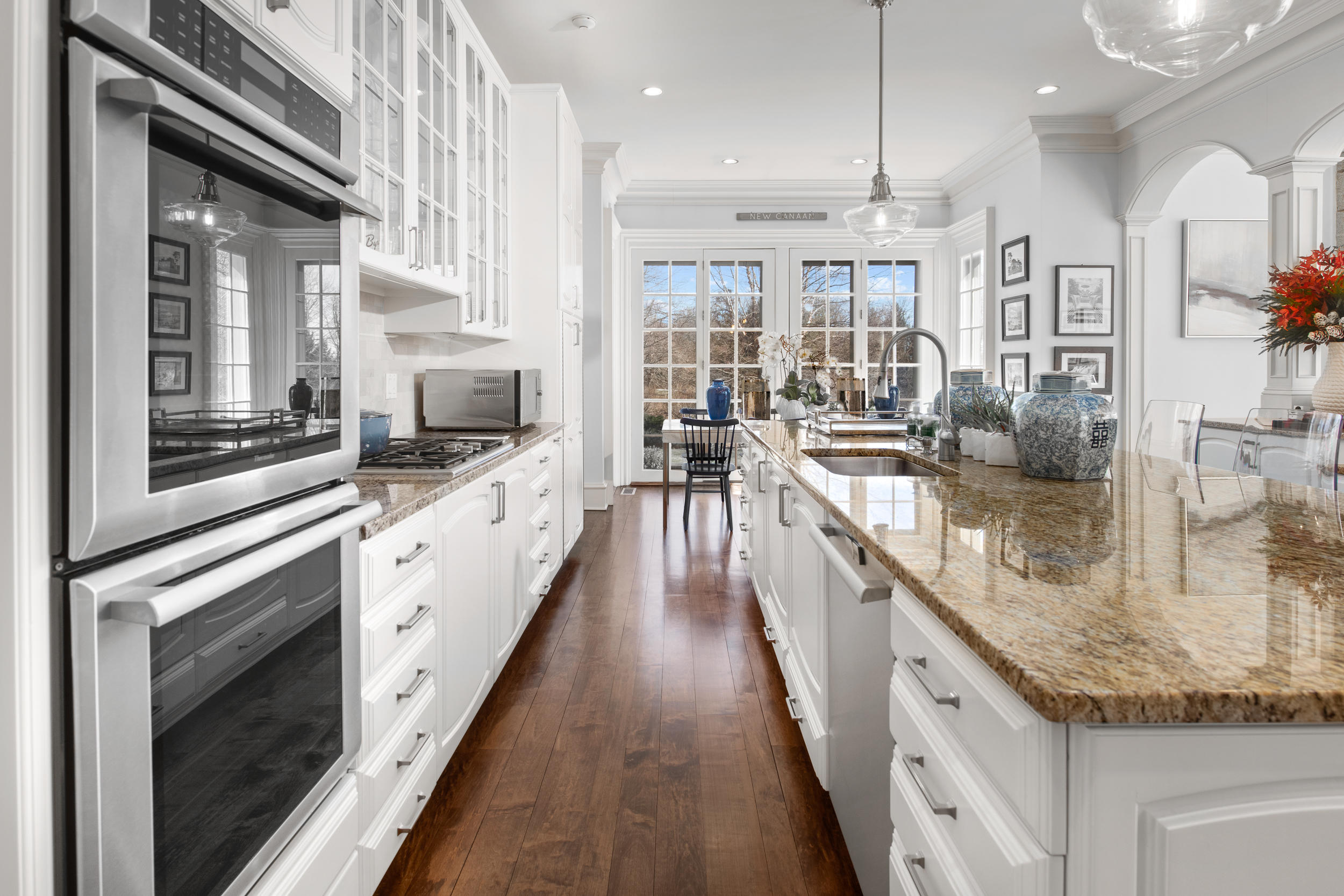 235 Brushy Ridge Road New Canaan, CT 06840 - Photo 15 of 28 a large kitchen with granite countertop a large counter top appliances and cabinets