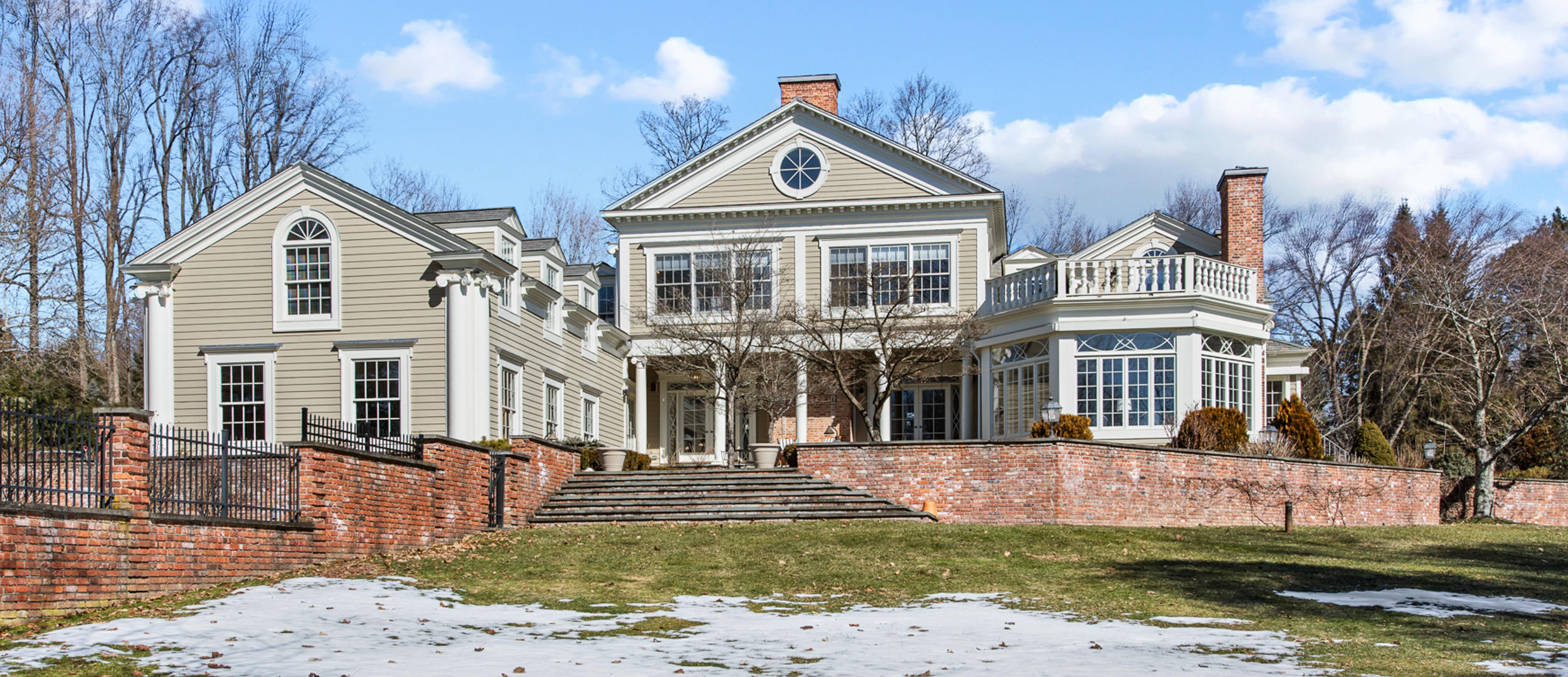 235 Brushy Ridge Road New Canaan, CT 06840 - Photo 28 of 28 a front view of a house with a yard