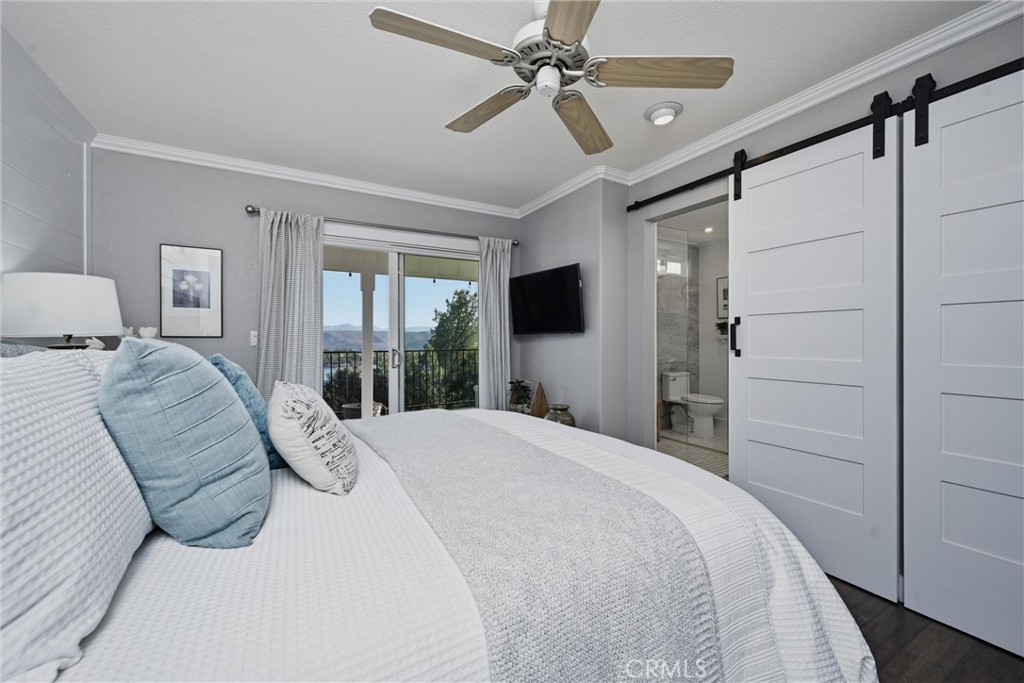 17432 Greenridge Road Hidden Valley Lake, CA 95467 - Photo 30 of 72 a bedroom with a large bed and a window