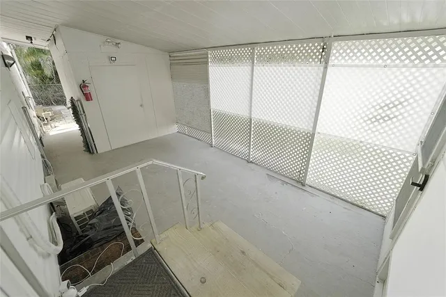 a kitchen with cabinets and white appliances