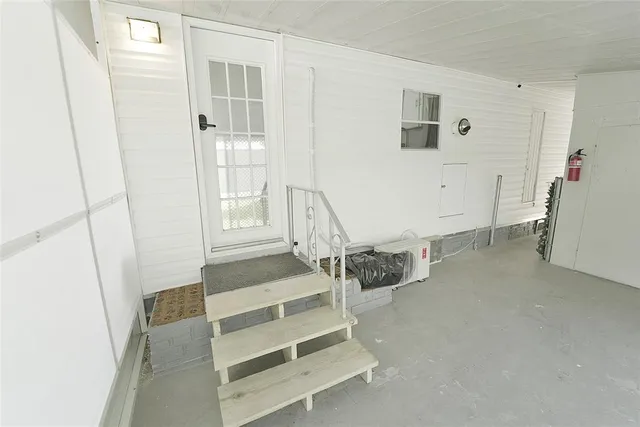 a view of an empty room and window