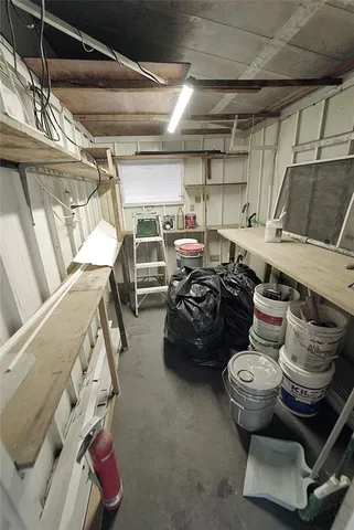 a white toilet sitting next to a shower