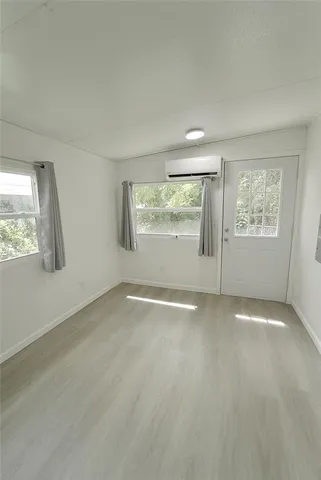 a bathroom with a double vanity sink and mirror with shower