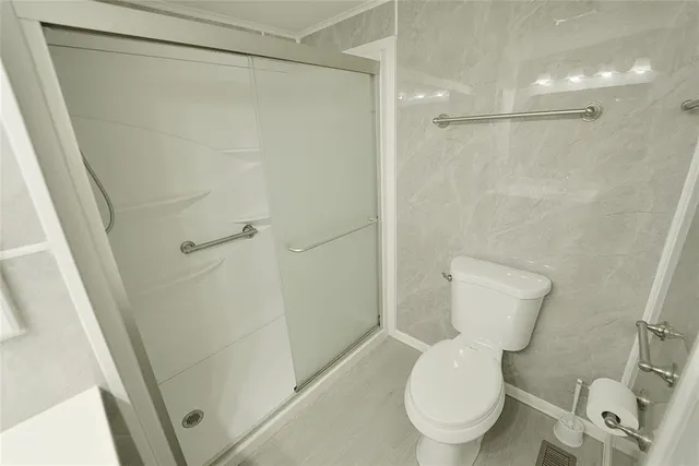 a room with granite countertop cabinets and sink