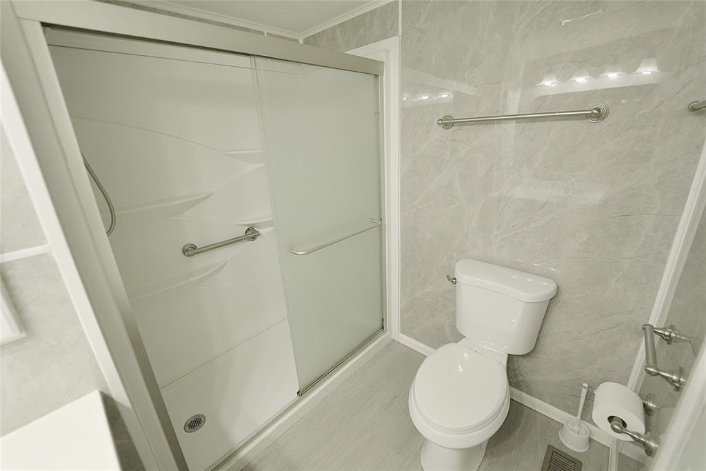 8520 Southwest 18th Court Davie, FL 33324 - Photo 32 of 48 a white toilet sitting next to a shower