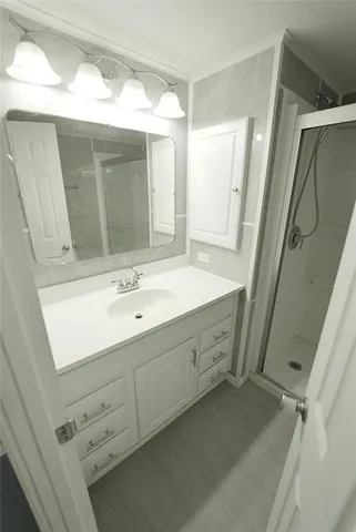 a kitchen with appliances a sink and cabinets