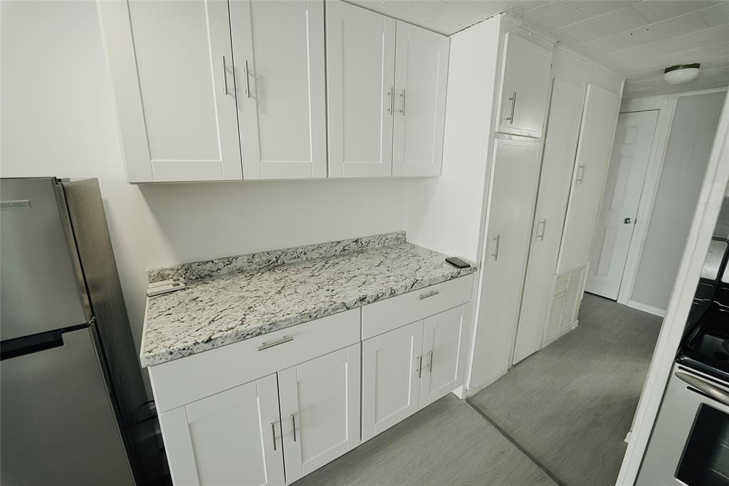 8520 Southwest 18th Court Davie, FL 33324 - Photo 36 of 48 a room with granite countertop cabinets and sink