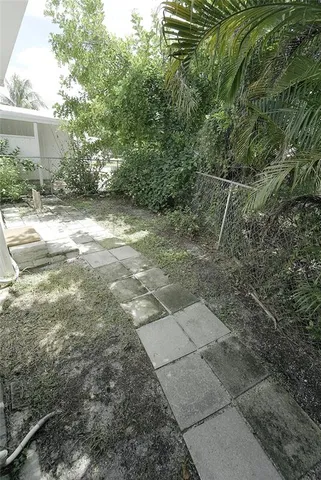 a house with swimming pool in front of it