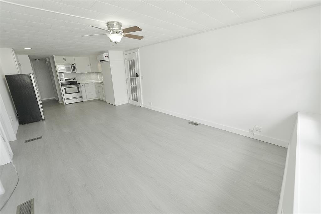 8520 Southwest 18th Court Davie, FL 33324 - Photo 39 of 48 wooden floor in an empty room with a window