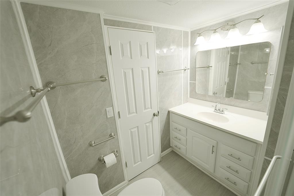 8520 Southwest 18th Court Davie, FL 33324 - Photo 4 of 48 a bathroom with a sink a toilet and shower