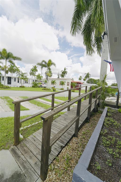 8520 Southwest 18th Court Davie, FL 33324 - Photo 42 of 48 a view of a swimming pool with a yard and furniture