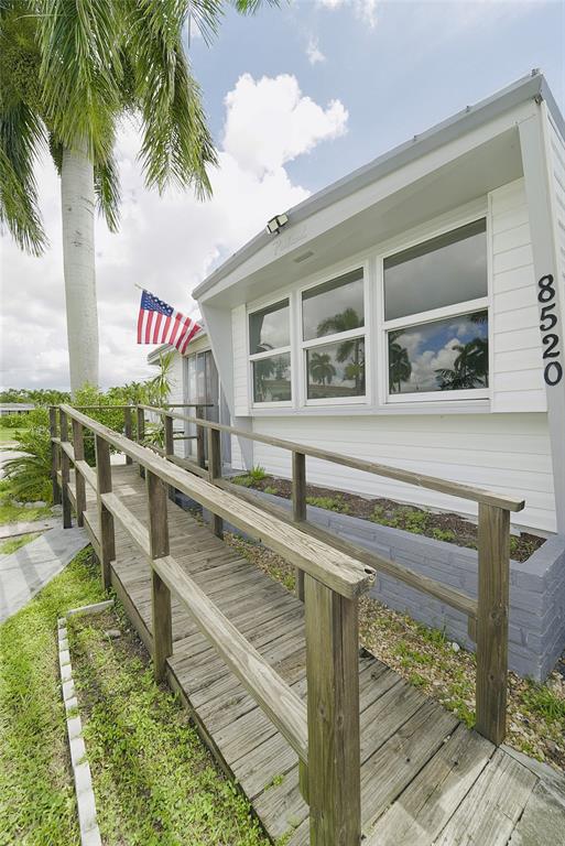 8520 Southwest 18th Court Davie, FL 33324 - Photo 9 of 48 a front view of a house with balcony