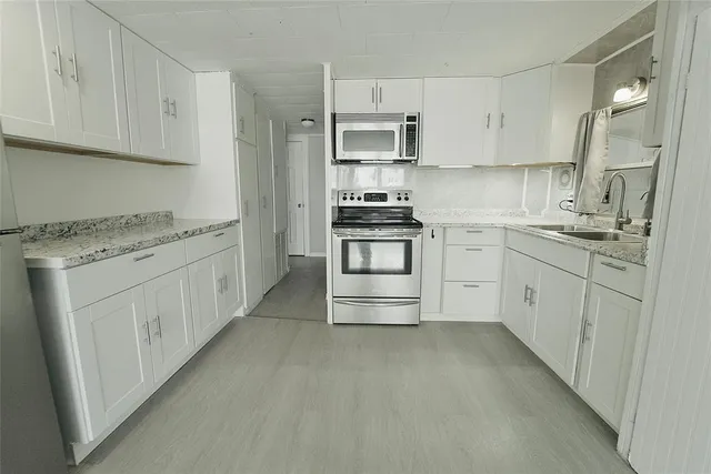 a front view of a house with a yard table and chairs