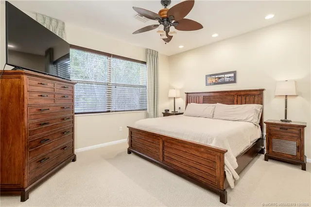 a bed room with a bed and a television