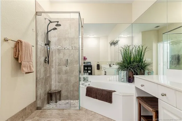 a bathroom with a tub shower and sink