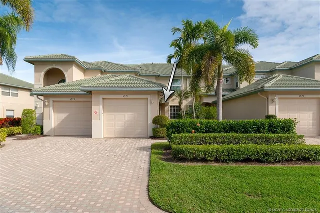 front view of a house with a garden