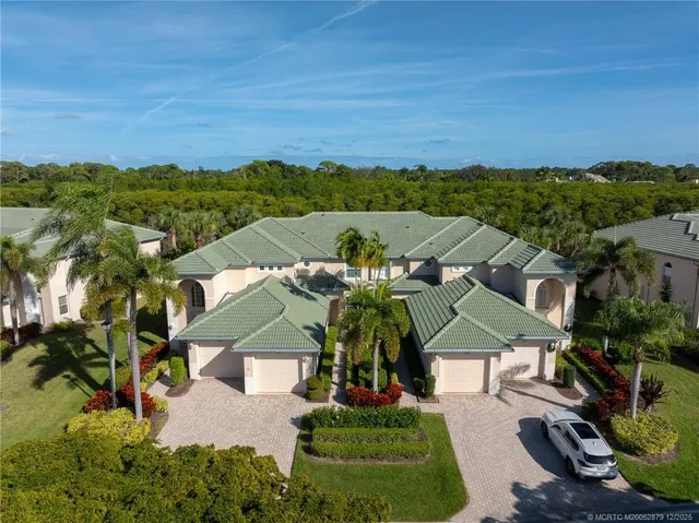 an aerial view of a house with a garden