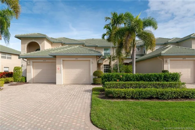 front view of a house with a garden