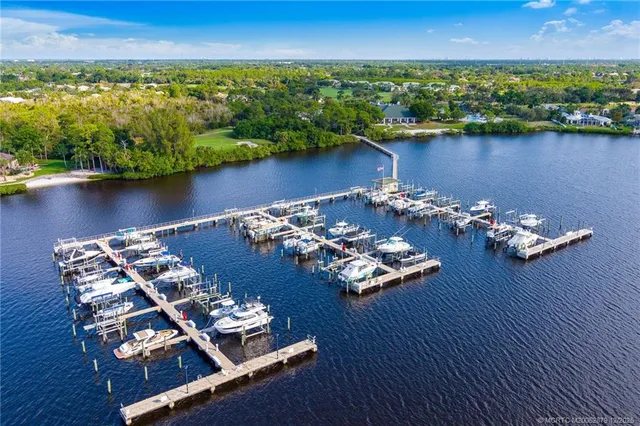 an aerial view of a house with a lake view