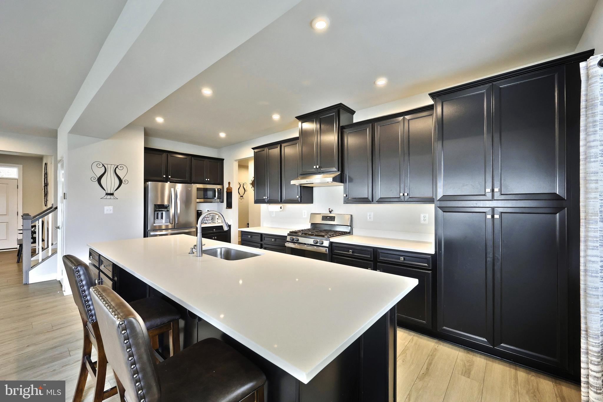 1480 Beck Mill Road Hanover, PA 17331 - Photo 7 of 71 a kitchen with refrigerator and chairs