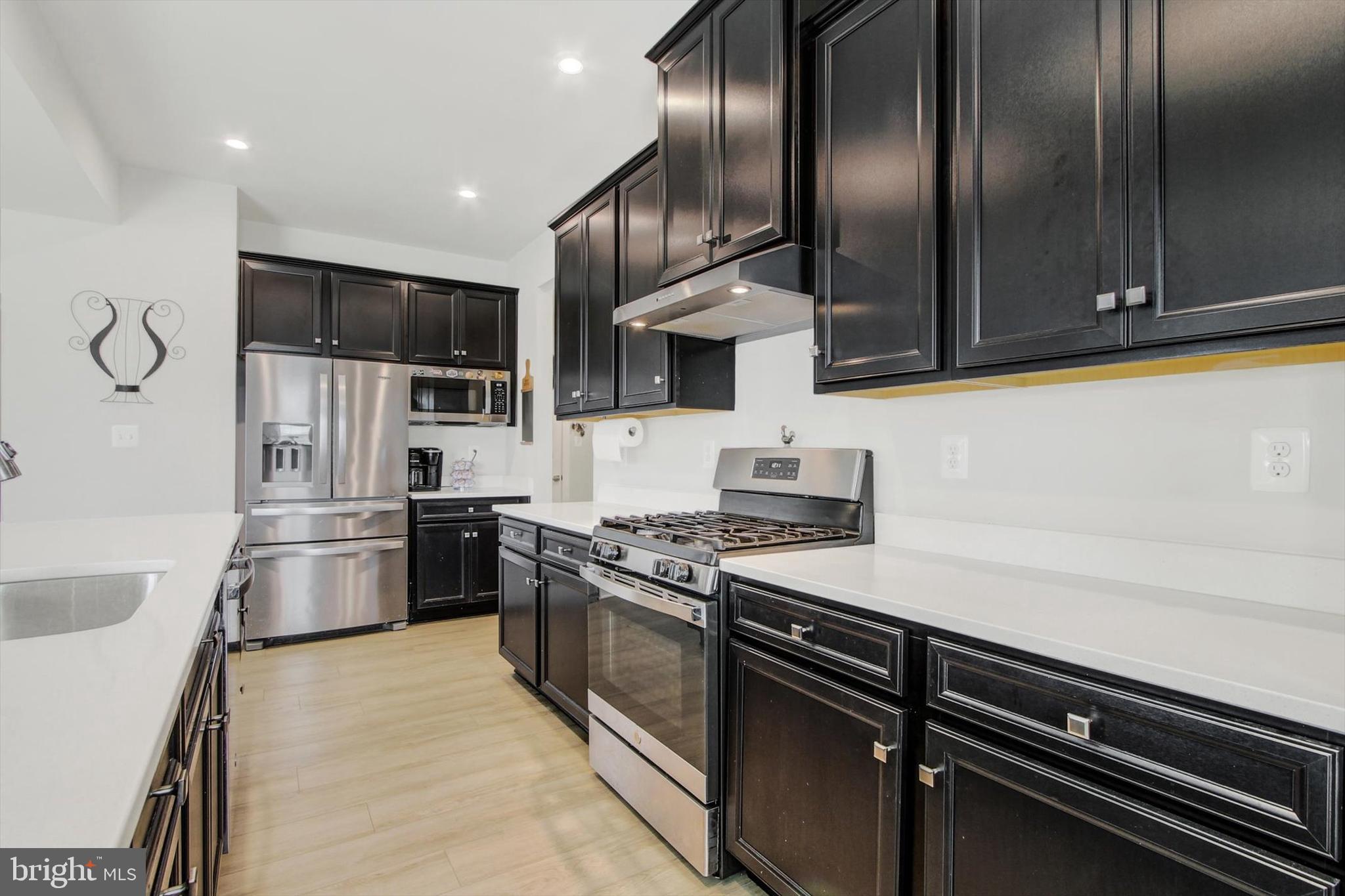 1480 Beck Mill Road Hanover, PA 17331 - Photo 9 of 71 a kitchen with stainless steel appliances granite countertop a sink a stove and a refrigerator