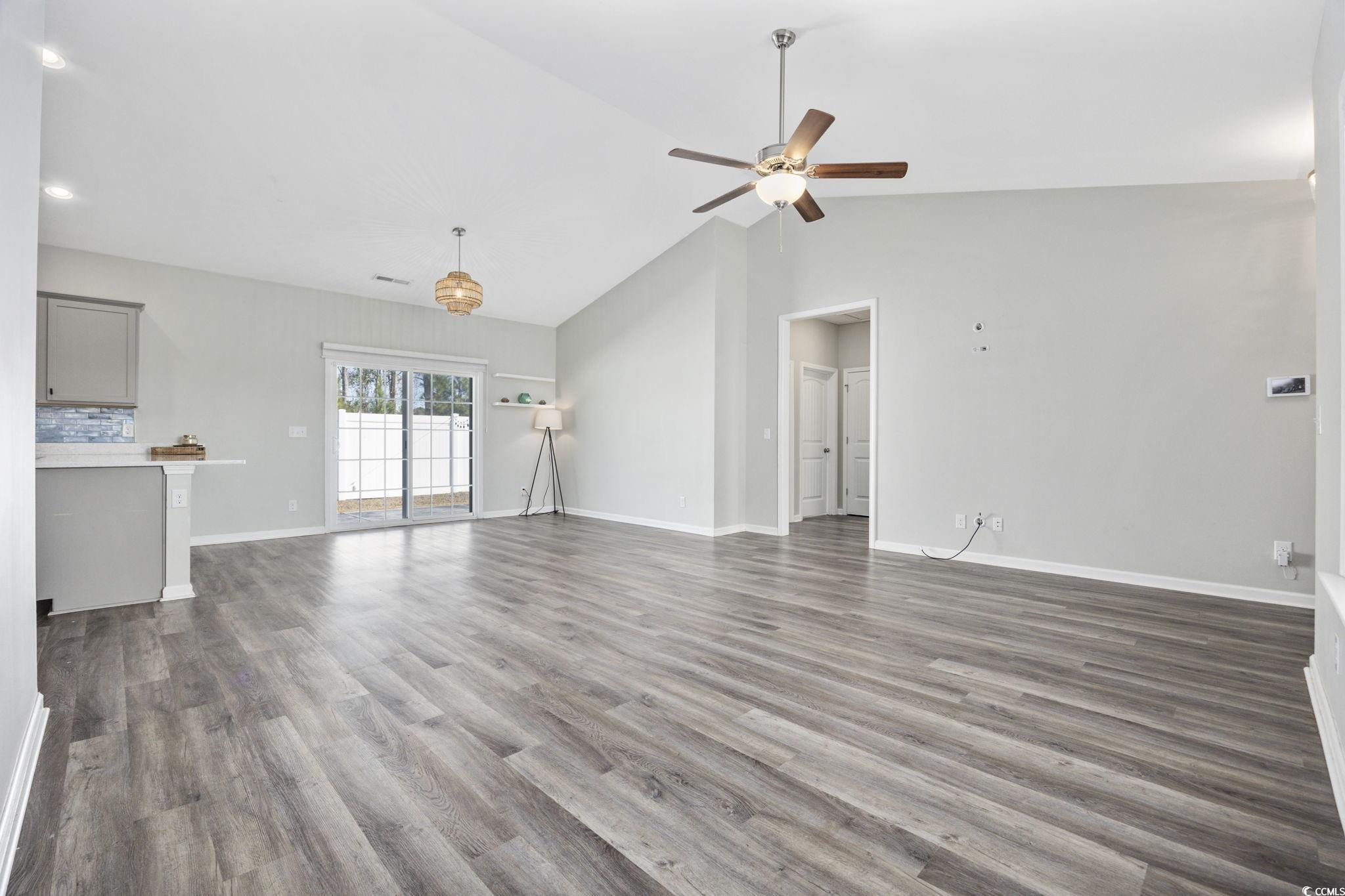 200 Obi Lane Surfside Beach, SC 29575 - Photo 6 of 40 Unfurnished living room with dark hardwood / wood-