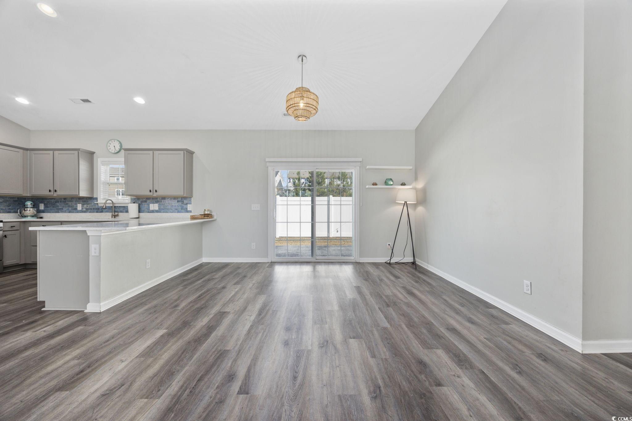 200 Obi Lane Surfside Beach, SC 29575 - Photo 9 of 40 Kitchen featuring kitchen peninsula, dark hardwood