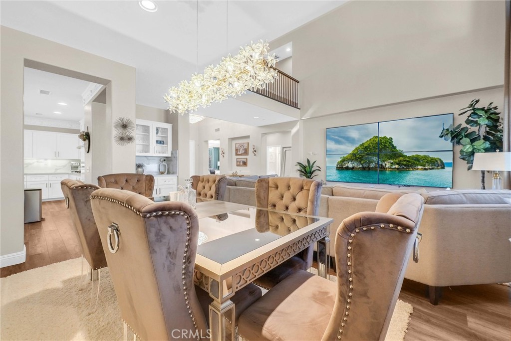 11499 Bridgeway Drive Riverside, CA 92505 - Photo 13 of 65 a living room with furniture a chandelier and a fireplace